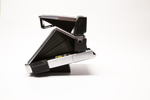 Tripod mount for polaroid - for,